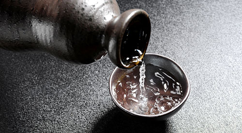 Sake being poured into a glass