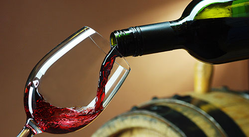 Wine being poured into a glass.